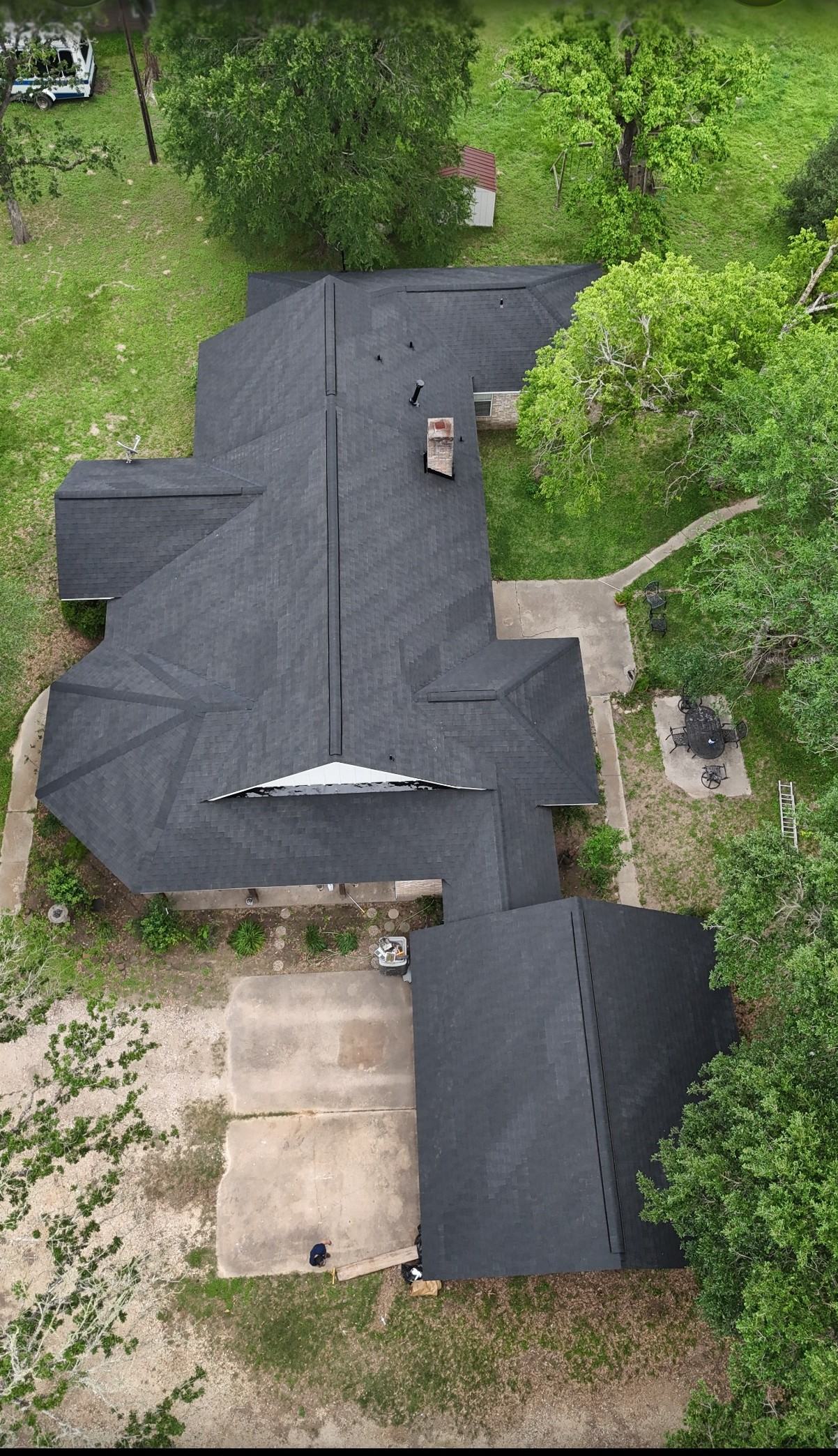 Aerial view of a completed roof replacement by A Vazquez Roofing in Navasota, TX